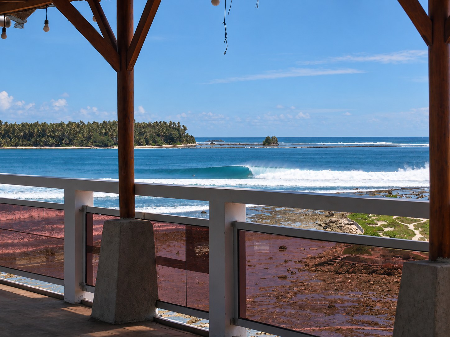 Surfer riding the famous right-hander at Lagundri Bay, Nias